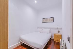 Posteľ alebo postele v izbe v ubytovaní Cozy and bright 3BD apartment by Gran Via