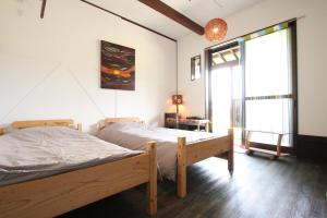 Llit o llits en una habitació de うふた