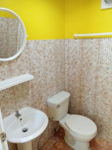 a bathroom with a white toilet and a sink at HomeState Bang Maprao in Ban Hin Sam Kon