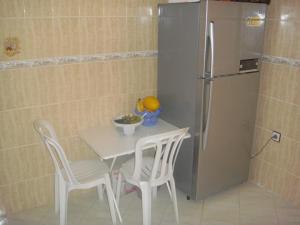 A kitchen or kitchenette at Location Mohammedia Mannesman Plages