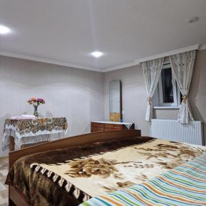 Una cama o camas en una habitación de Colchis Guest House