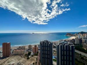 a view of a city and the ocean with buildings at Intempo Seaview Luxury Reinapart in Benidorm