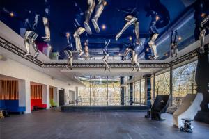 a room with a blue ceiling with dancing skeletons on it at Crowne Plaza Antwerpen, an IHG Hotel in Antwerp