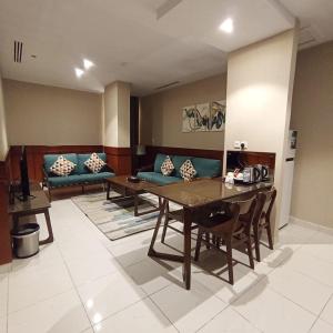 Posezení v ubytování Biz Hotel Apartments + 37 fotografií