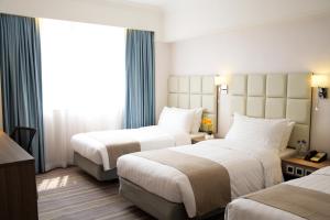Letto o letti in una camera di Panda Hotel