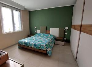 Postel nebo postele na pokoji v ubytování Nanà Holiday House