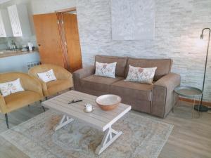 a living room with a couch and a coffee table at Stanford Hills Estate in Stanford