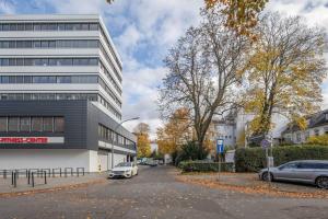 a parking lot in front of a building at Hamburg City Apartment in Hamburg