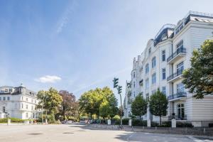 a street in a city with white buildings at Charming Apartment in prime location in Hamburg +12 photos