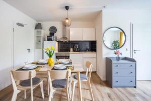 a kitchen and dining room with a table and chairs at Schulterblatt-Apartments Hamburg Unit 3 For 5 in Hamburg