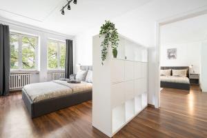 Postel nebo postele na pokoji v ubytování Living in Munich City Center