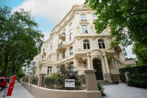 a large white building with a sign in front of it at Hamburg City Apartment for 7 in Hamburg