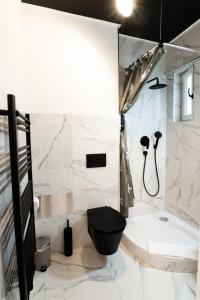 a white bathroom with a toilet and a shower at Hamburg - Cosy Apartment for 4 in Hamburg