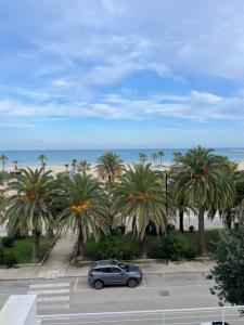 a car parked in a parking lot near the beach at RIVIERA PALACE - BILO SEA FRONT- Premium Villas in Giulianova