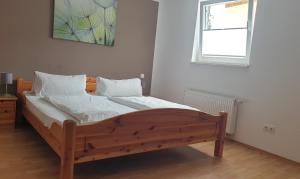 Postel nebo postele na pokoji v ubytování Gästehaus Sibylle