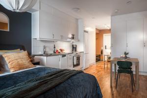 Kuchyň nebo kuchyňský kout v ubytování Guestly Homes - Elite Studio