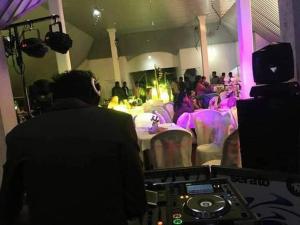 a man standing in front of a room with a crowd of people at American Star Hotel- Nuwaraeliya in Nuwara Eliya