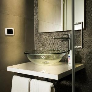 a bathroom with a glass bowl sink on a counter at Casa in Centro in Caserta