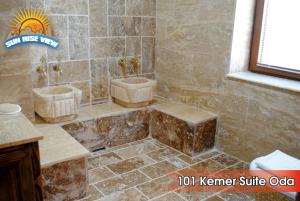 a bathroom with two sinks and a tub at Sun Rise View Hotel in Göreme