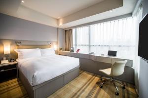 Ein Bett oder Betten in einem Zimmer der Unterkunft One Dundas
