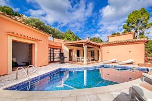 an image of a villa with a swimming pool at Beach Villa Margot in Port de Pollensa