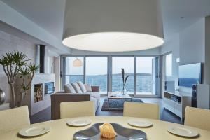 a living room with a table and chairs at Villa Roca in Vis