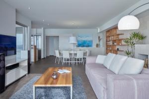 a living room with a couch and a table at Villa Roca in Vis