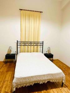 A bed or beds in a room at Messenian Style House with Great Views