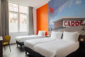 Postel nebo postele na pokoji v ubytování The Manor Amsterdam