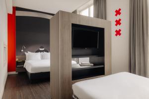 Postel nebo postele na pokoji v ubytování The Manor Amsterdam