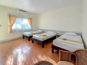 Letto o letti in una camera di Silamanee Resort & Spa Hotel