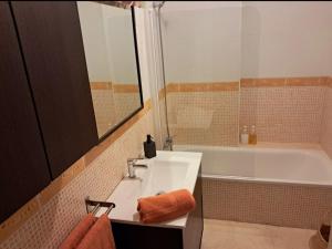 a bathroom with a sink and a bath tub at Apartamento Ataraxia in Ronda +6 photos