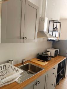 a kitchen with a sink and a counter top at Ozone Hill Panoramic Residence Thong Nai Pan Beach in Thong Nai Pan Noi