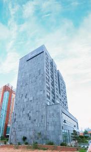 a building with a sign on the top of it at Gunsan Little Prince Condo in Gunsan