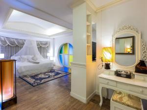 Letto o letti in una camera di Silamanee Resort & Spa Hotel