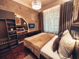Posteľ alebo postele v izbe v ubytovaní Alfons Boutique Hotel