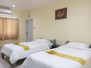 Letto o letti in una camera di Silamanee Resort & Spa Hotel