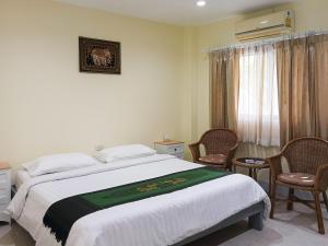 Letto o letti in una camera di Silamanee Resort & Spa Hotel