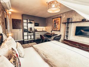 Posteľ alebo postele v izbe v ubytovaní Alfons Boutique Hotel
