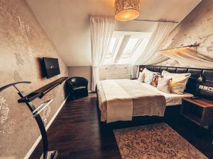 Posteľ alebo postele v izbe v ubytovaní Alfons Boutique Hotel
