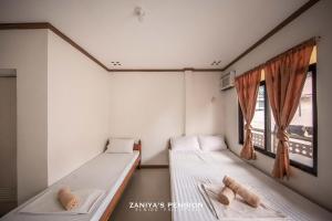 Postel nebo postele na pokoji v ubytování Zaniya's Pension