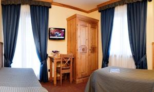 Postel nebo postele na pokoji v ubytování Hotel Crampon