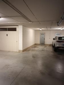 a parking garage with a car parked in it at Appartamento bicamere Monsummano Terme in Monsummano