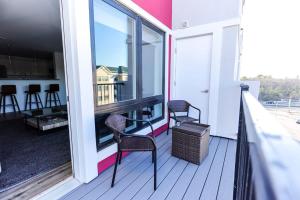 two chairs on a balcony with a view of a building at 1BR Luxury Apartment Peabody - Unit #606 in Peabody