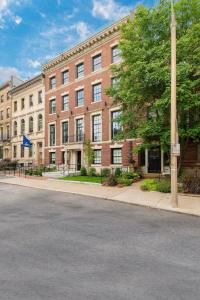 an empty street in front of a large brick building at Modern Studio in Historic Boston - Garden Unit #2 in Boston
