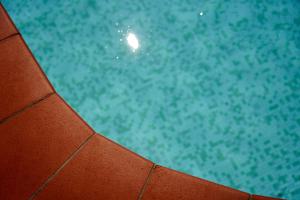 a close up of the top of a swimming pool at Hotel Gabbiano - Garda Lake Collection in Garda