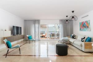 Et opholdsområde på Deluxe 2 bed Apartment