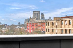 a view of a city with a church and buildings at Apartment 47 with secure Free parking in York