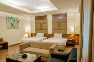 Postel nebo postele na pokoji v ubytování Hotel Alia Cikini + 37 fotografií