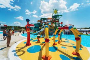 a large water park with a water slide at The Sol Home - Mobile Home in Drage, Pakoštane in Pakoštane